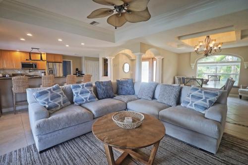 a living room with a couch and a table at Paradise with a pool, pier and private beach area in Osprey