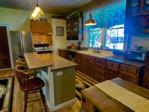 a kitchen with a sink and a counter top at Restored historic home near ND and Amish Country in Elkhart