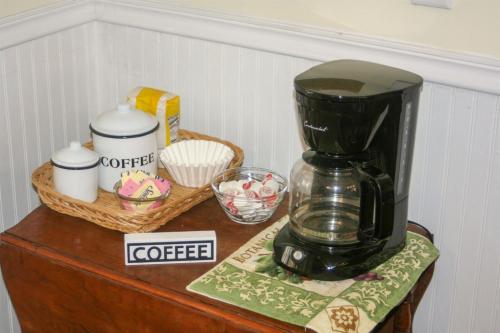 a coffee maker sitting on top of a table at Restored historic home near ND and Amish Country in Elkhart