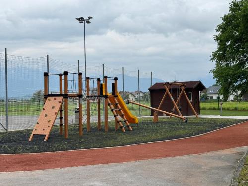 an empty playground with a slide and a slideintend at Mojca's nest apartment in Mengeš