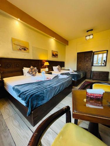 Postel nebo postele na pokoji v ubytování New Location Hotel