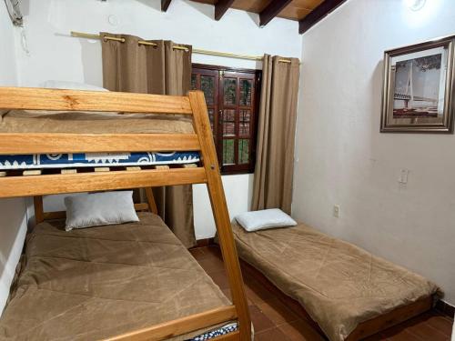 Una cama o camas en una habitación de La Casa Siberia