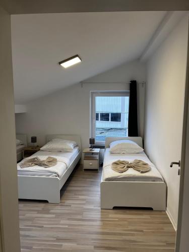 Katil atau katil-katil dalam bilik di CityStay Bergisch Gladbach Apartments & Rooms