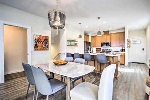 a kitchen and dining room with a table and chairs at The Moby House Coastal Retreat with Ocean Views & Hot Tub in Depoe Bay