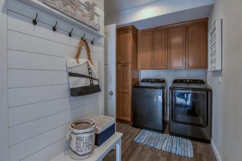 a kitchen with a stove and a dishwasher at The Moby House Coastal Retreat with Ocean Views & Hot Tub in Depoe Bay
