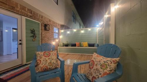 two blue chairs with pillows sitting in a room at Canal Run 7 in Gulf Shores
