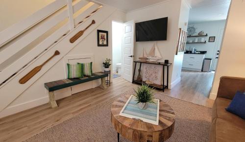 a living room with a couch and a table at Canal Run 7 in Gulf Shores