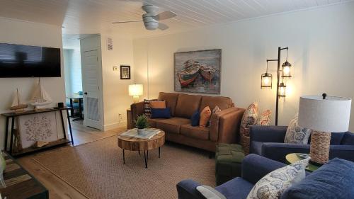 a living room with a couch and a table at Canal Run 7 in Gulf Shores
