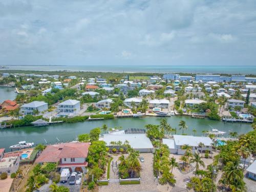 an aerial view of a town with a harbor at Sombrero Shores - Waterfront Oasis w Pool, 63 Dock in Marathon
