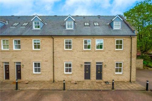 a large brick house with white windows and doors at Town House with Hot Tub & Free Parking in Central Station