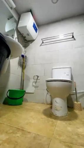 a bathroom with a toilet and a sink at Peters Apartments in Lagos