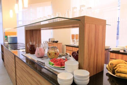 a kitchen with a counter with food on it at The World Indaiatuba in Indaiatuba
