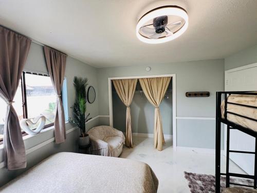 a bedroom with a bed and a ceiling fan at Hogar in Port Richey
