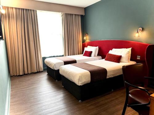 Ένα ή περισσότερα κρεβάτια σε δωμάτιο στο HNFC Stays - Luxury TWINs