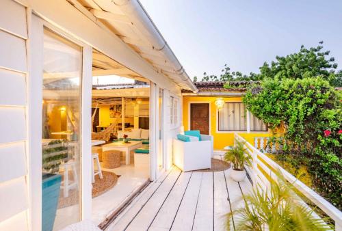 a house with a deck with a view of the backyard at Pousada Duna Beach in Jericoacoara