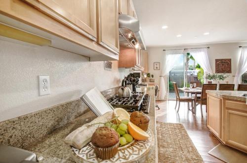 a kitchen with a tray of muffins on a counter at Healdsburg Winemaker's Home in Windsor