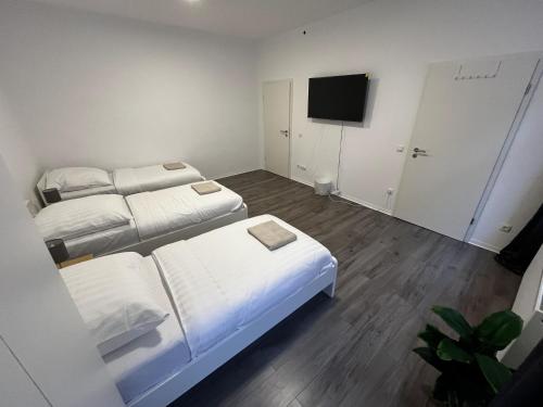 Katil atau katil-katil dalam bilik di CityStay Bergisch Gladbach Apartments & Rooms