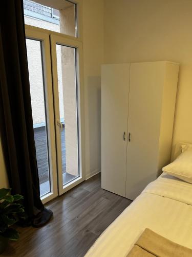 Katil atau katil-katil dalam bilik di CityStay Bergisch Gladbach Apartments & Rooms