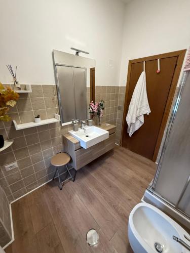 a bathroom with a sink and a mirror at Roma sweet house in Rome