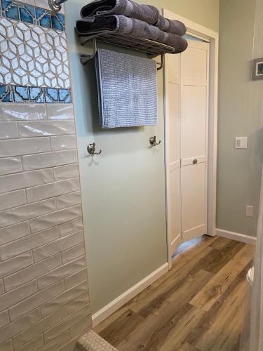 a door in a room with a closet at Lupine Cottage - Alaska at your doorstep! in Palmer