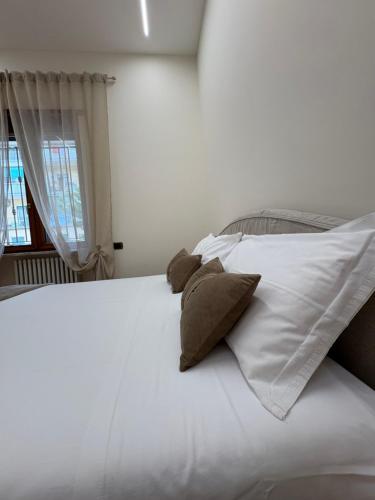 Ένα ή περισσότερα κρεβάτια σε δωμάτιο στο Ninella Apartment
