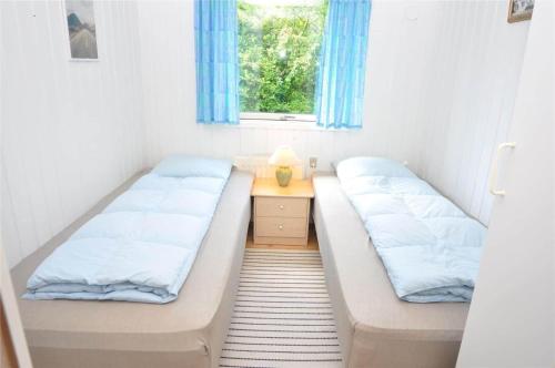 Postel nebo postele na pokoji v ubytování 30171-Ulfborg-Snerlevej-492