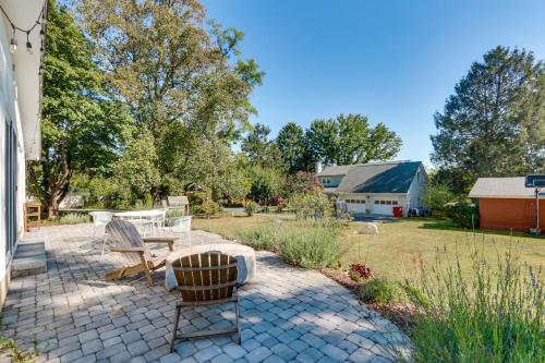 a patio with two chairs and a table at Walkable Location Historic Home in Charles Town! in Charles Town