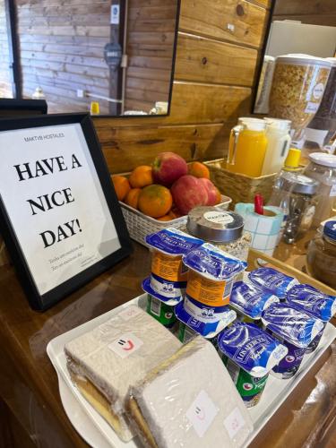 a table with a sign that reads have a nice day at MAKTVB Costanera - Hostal Boutique in Santiago