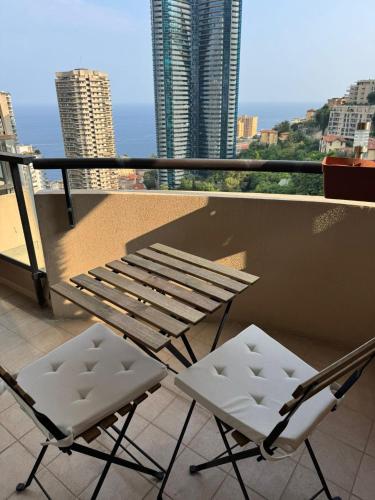two chairs and a table on top of a balcony at Eden butler monaco in Beausoleil