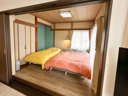 a bedroom with a bed in a small room at Matsune - Vacation STAY 12969v in Noboribetsu
