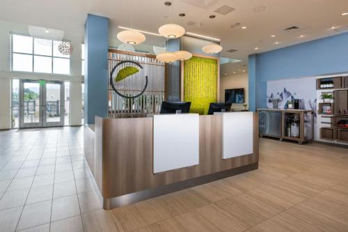 an office lobby with a reception desk and chairs at Element New Orleans Downtown in New Orleans