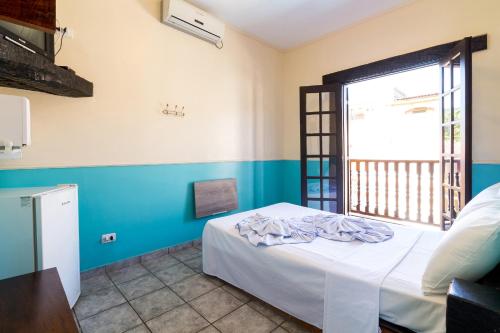Aldeia Da Lagoinha tesisinde bir odada yatak veya yataklar