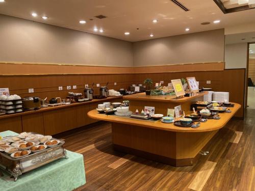 a restaurant with a counter with food on it at Smile Hotel Tokushima - Vacation STAY 10493v in Tokushima