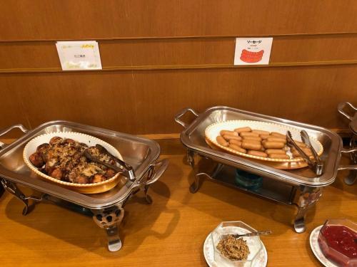 two trays of food on a table with plates of food at Smile Hotel Tokushima - Vacation STAY 10491v in Tokushima
