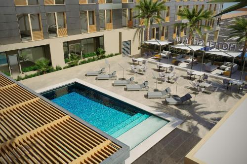 an overhead view of a swimming pool in a building at AC Hotel by Marriott Georgetown Guyana in Georgetown