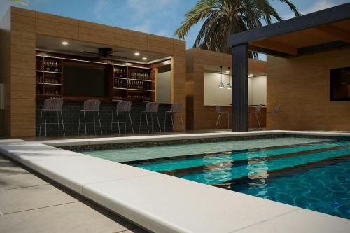 a swimming pool in a house with a cinema at AC Hotel by Marriott Georgetown Guyana in Georgetown