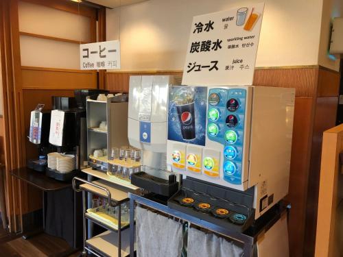 a drink counter in a restaurant with a vending machine at Smile Hotel Tokushima - Vacation STAY 10510v in Tokushima