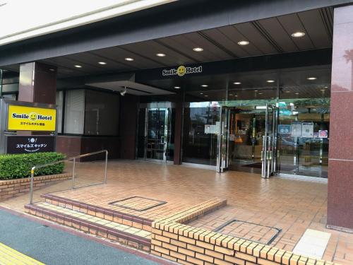 a lobby of a building with a revolving door at Smile Hotel Tokushima - Vacation STAY 10502v in Tokushima