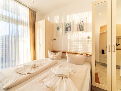 Postel nebo postele na pokoji v ubytování Elegant eingerichtete Ferienwohnung