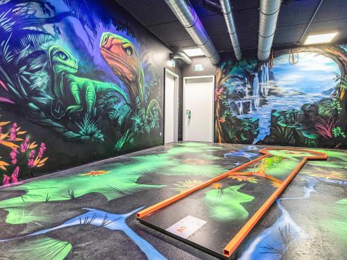 a room with a mural on the wall at 6 Personen Ferienhaus in Wendtorf in Wendtorf