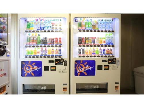 a refrigerator filled with lots of bottles of soda at Smile Hotel Shimonoseki - Vacation STAY 12586v in Shimonoseki