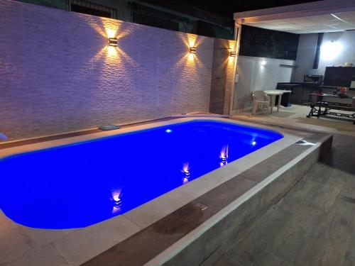 Kolam renang di atau dekat dengan Linda casa, espaçosa, confortável e tranquila