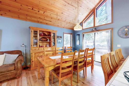 a dining room with a wooden table and chairs at Schussing Escape in Truckee