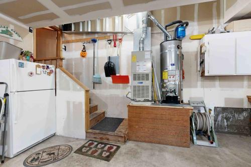 a kitchen with a counter and a refrigerator at Schussing Escape in Truckee