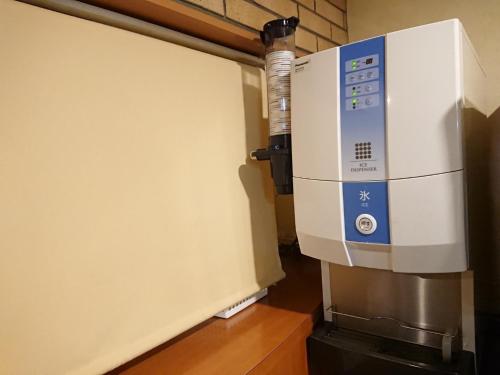 a microwave oven sitting on top of a wall at Smile Hotel Kobe Motomachi - Vacation STAY 05017v in Kobe