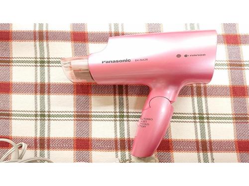 a pink hair dryer sitting on top of a blanket at Smile Hotel Kobe Motomachi - Vacation STAY 05017v in Kobe
