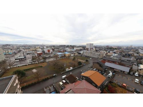 an aerial view of a city with buildings at Smile Hotel Takaoka Ekimae - Vacation STAY 89632v in Takaoka