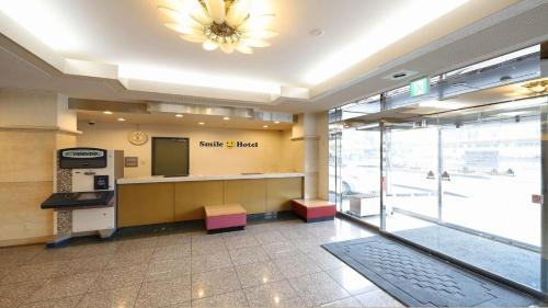 a lobby of a santa clara island office at Smile Hotel Takaoka Ekimae - Vacation STAY 89632v in Takaoka