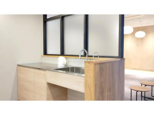 a kitchen with a sink and two windows at DIG the Osaka - Vacation STAY 14540v in Suita
