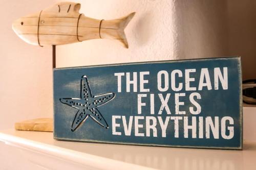 a sign that reads the ocean fires everything at South Bluff Beauty Ocean Views Galore 2 Bedroom in La Selva Beach